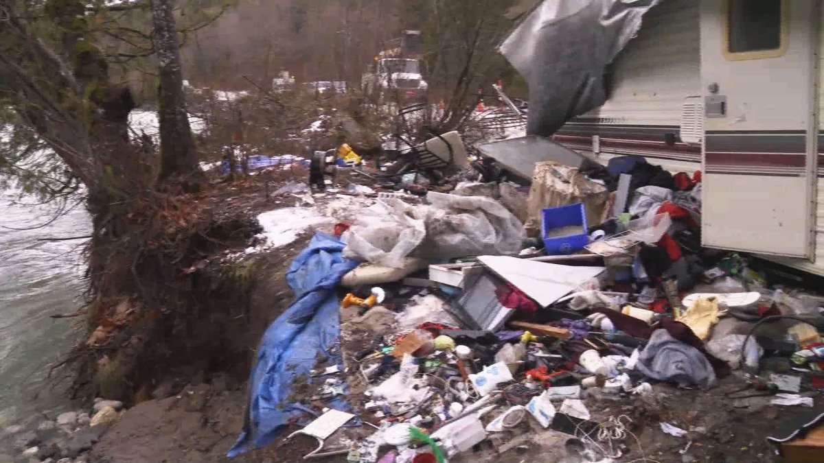 Volunteers clean up an abandoned encampment in the Fraser Valley.