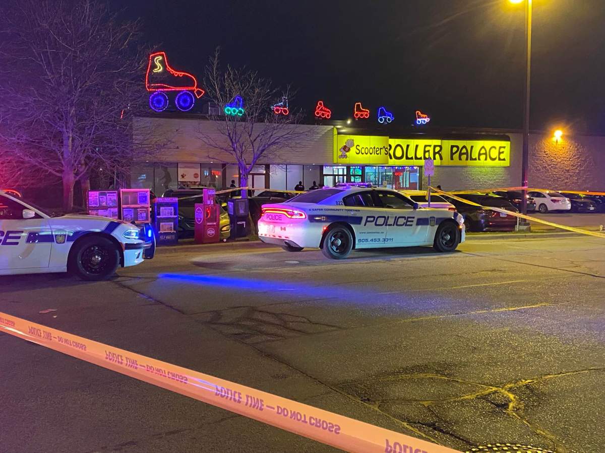 Police at the scene of a shooting near Royal Windsor Drive and Southdown Road on Dec. 7, 2022.