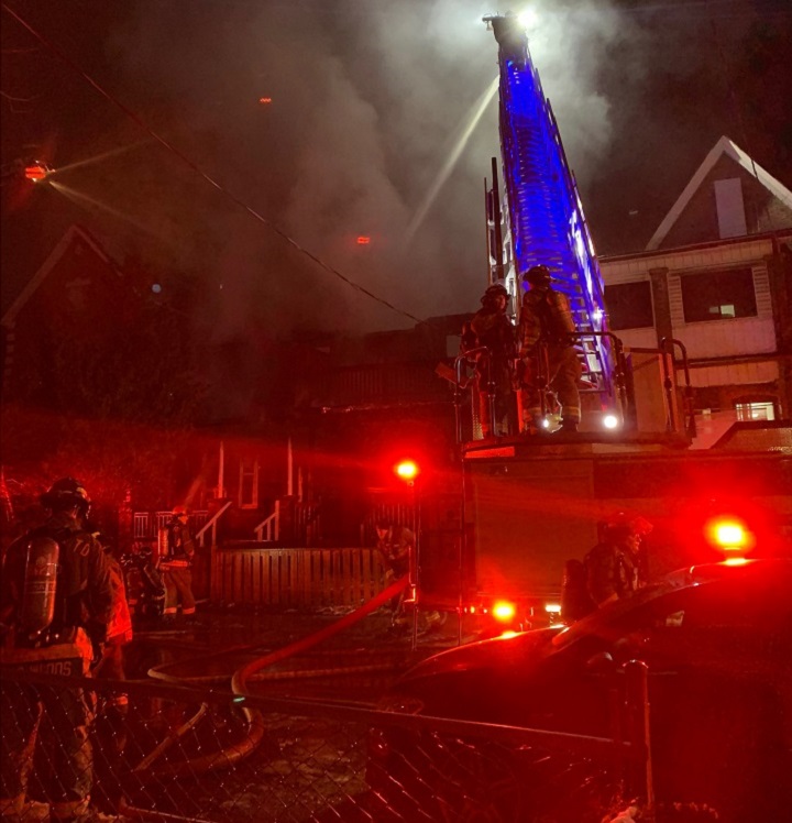Firefighters battling a fire at Grange Avenue in Toronto on Dec. 14, 2022.