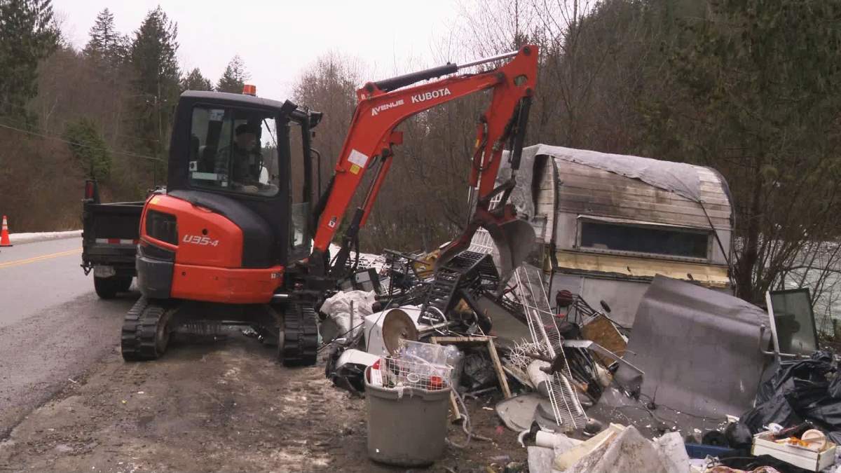 Volunteers clean up an abandoned encampment in the Fraser Valley.