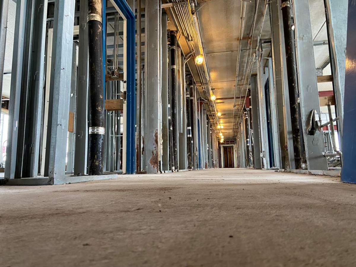 Empty hallways on second floor of old hotel.