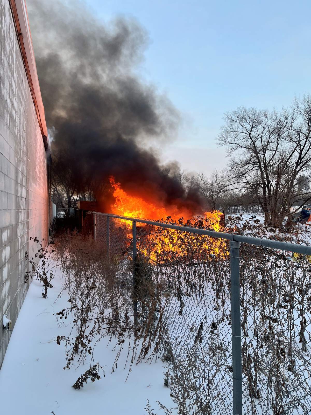 A fire at a homeless camp on Higgins Avenue early Monday.