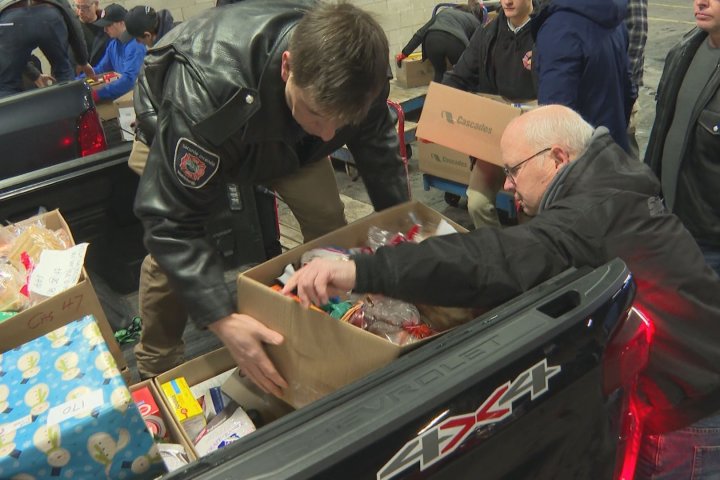 Montreal firefighters deliver Christmas cheer with holiday baskets