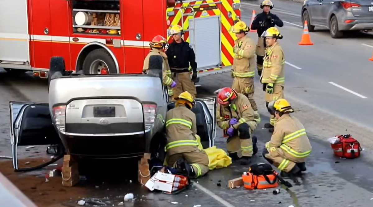 A Kingston woman survived a spectacular crash which left her vehicle on its roof.