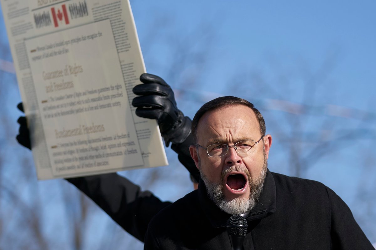 FILE - Pastor Henry Hildebrandt speaks during a demonstration against measures taken by public health authorities to curb the spread of COVID-19, in St. Thomas, Ont., Saturday, Nov. 14, 2020. 