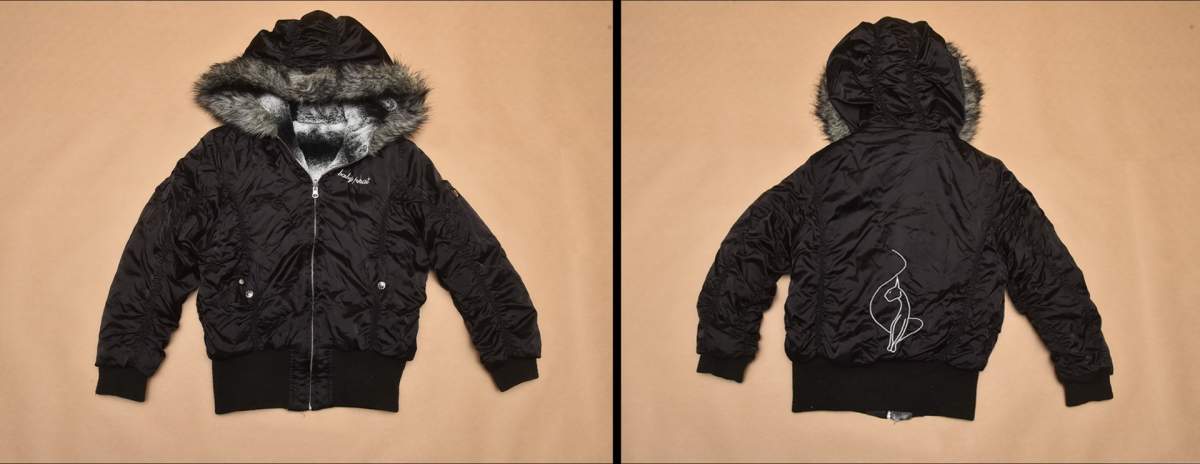 One side of a reversible jacket police believe an unidentified homicide victim wore.