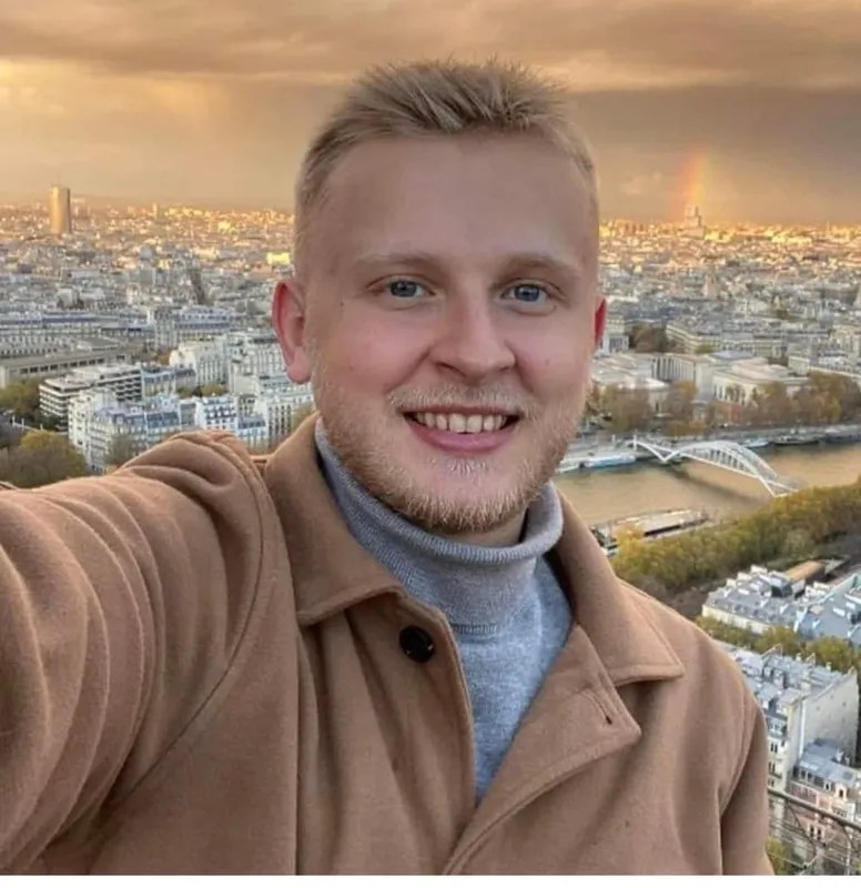 Image of Ken DeLand in Paris at the top of the Eiffel Tower.