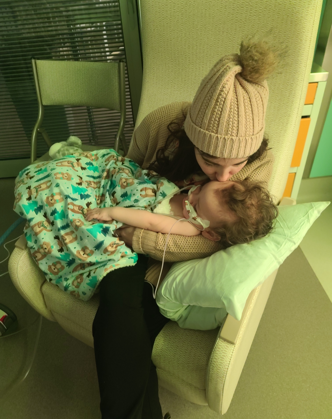 Kayla Jakubowski holding Barrett for the first time in 11 days in the hospital.