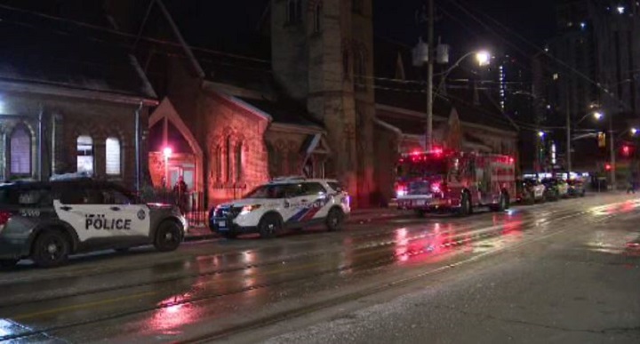Crews on scene following a deadly fire near Dundas and Sherbourne streets on Dec. 13, 2022.