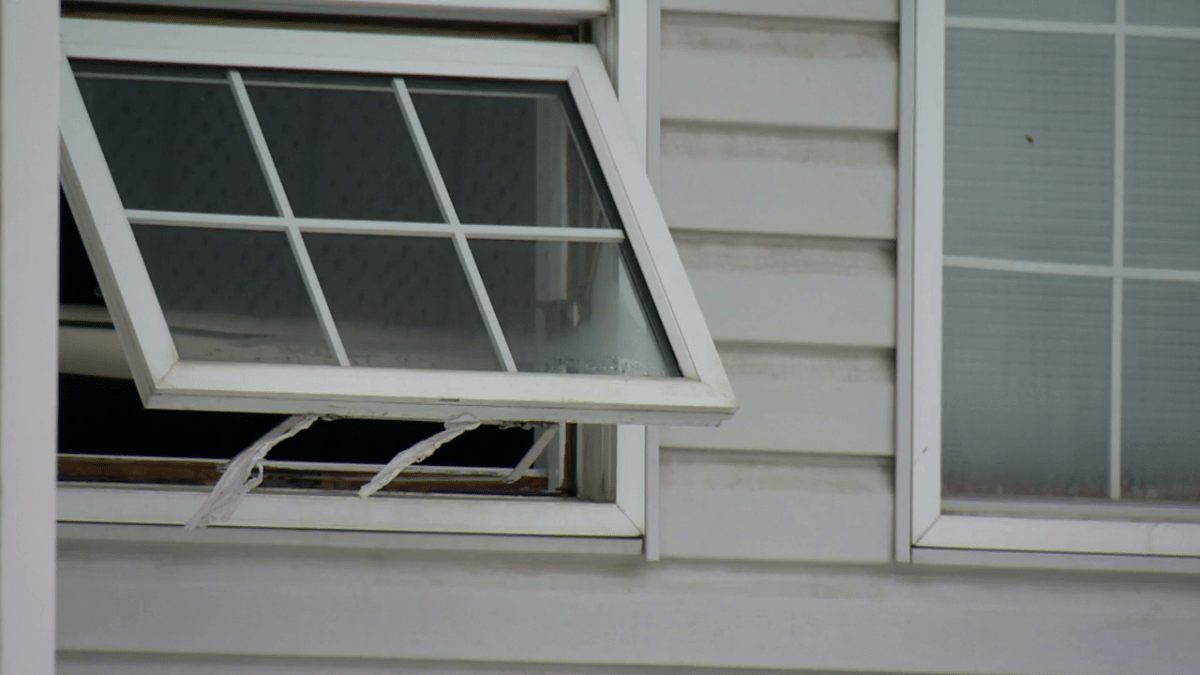 An open window of a home on the 2800 block of 15 Avenue S.E. after the Calgary Fire Department said they responded to a fire in the basement on Dec. 25, 2022.