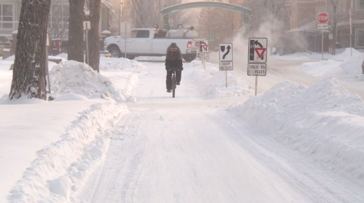 A cyclist using a bike lane in Edmonton in Jan. 2021.