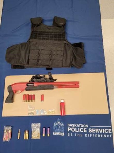 Saskatoon police say they saw a man they believed had a firearm walking around the city Thursday night.