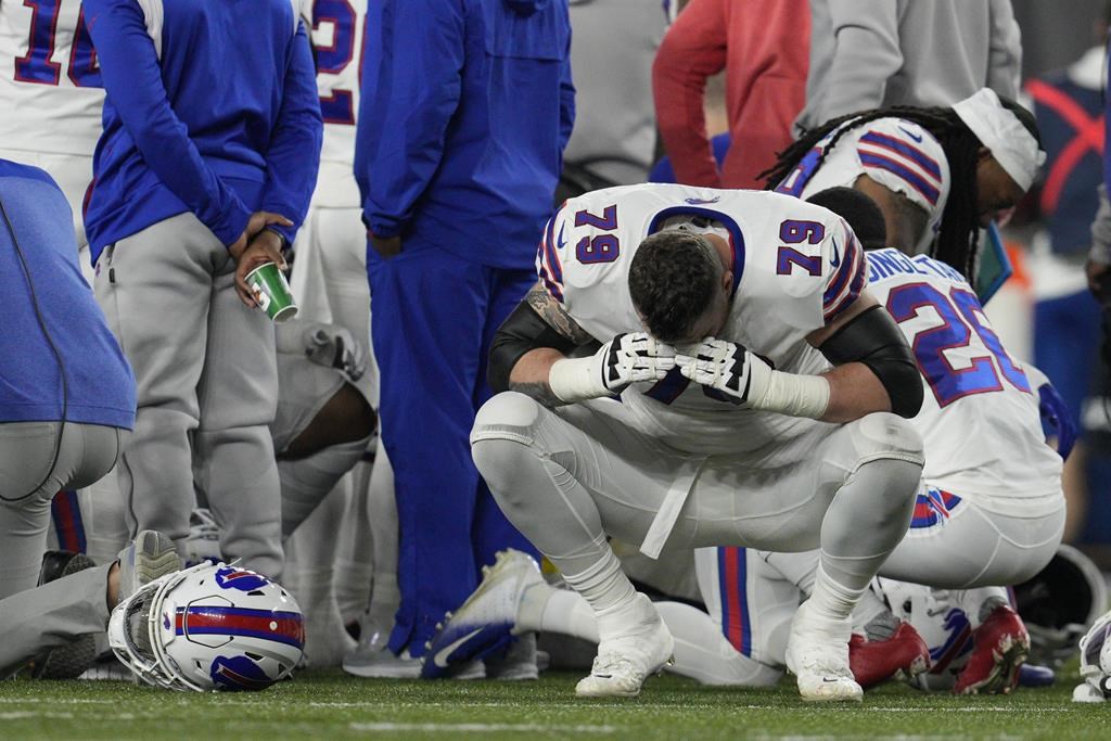 Buffalo Bills’ Spencer Brown (79) reacts as teammate Damar Hamlin is examined during the first half of an NFL football game against the Cincinnati Bengals, Monday, Jan. 2, 2023, in Cincinnati.