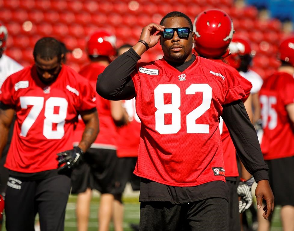 Calgary Stampeders' Nik Lewis, walks off the field during the first day of training camp in Calgary on June 1, 2014.