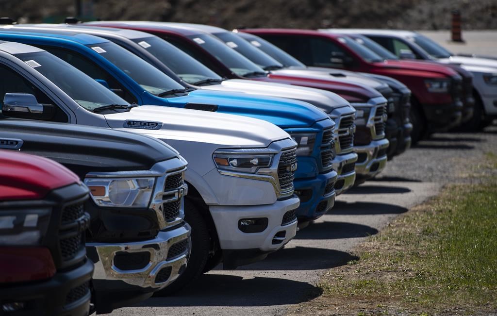 FILE: Pickup trucks for sale are seen at an auto mall in Ottawa, on Monday, April 26, 2021.