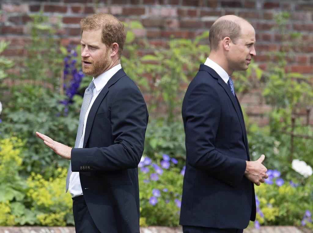 Prince Harry, left, and Prince William stand together during the unveiling of a statue they commissioned of their mother Princess Diana, on what would have been her 60th birthday, in the Sunken Garden at Kensington Palace, London, Thursday July 1, 2021. Prince Harry has said he wants to have his father and brother back and that he wants “a family, not an institution,” during a TV interview ahead of the publication of his memoir. The interview with Britain’s ITV channel is due to be released this Sunday.