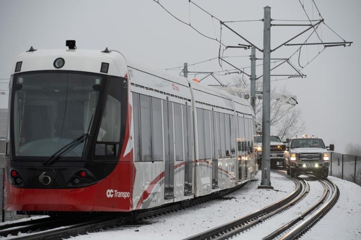 A stalled LRT OC Transpo train is seen near Lees Ave., station in Ottawa, on Friday, Jan. 6, 2023. Ottawa's light rail system is expected to be fully operational by the end of day.