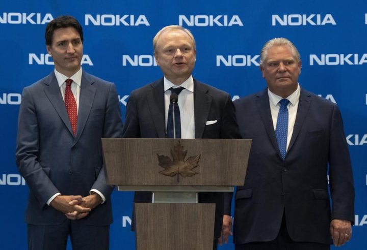 Prime Minister Justin Trudeau and Ontario Premier Doug Ford listen to Pekka Lundmark, President and CEO of Nokia respond to a question following an announcement Monday, October 17, 2022 in Ottawa. Nokia is opening a new office in downtown Toronto's Harbourfront community. The company says the new location is part of its efforts to expand its presence in Canada. 