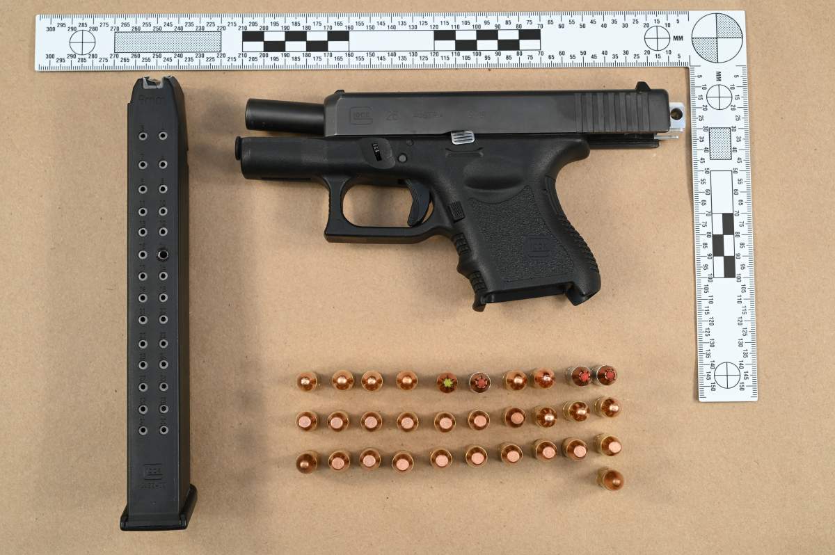 A handgun and ammunition seized as part of the investigation into an armed robbery at London Gold Buyer on Jan. 5, 2023.