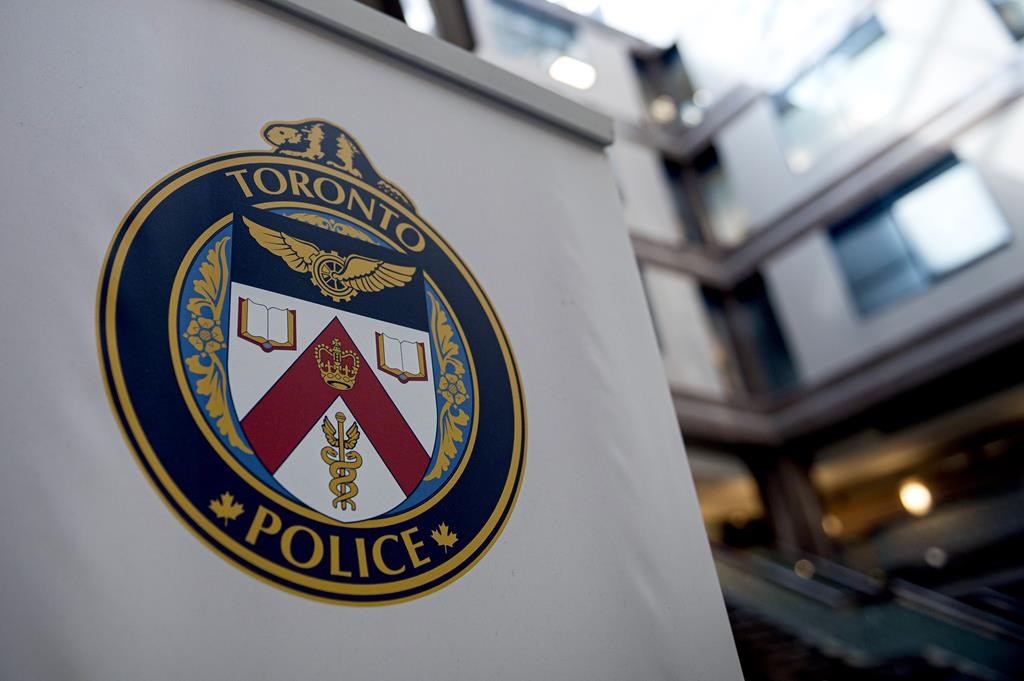 A Toronto Police Services logo is shown at headquarters, in Toronto, on Friday, August 9, 2019. Toronto police say they have not confirmed whether a group of teen girls who allegedly assaulted several people at public transit stations are the same ones that allegedly stabbed a homeless man on the same night. THE CANADIAN PRESS/Christopher Katsarov.