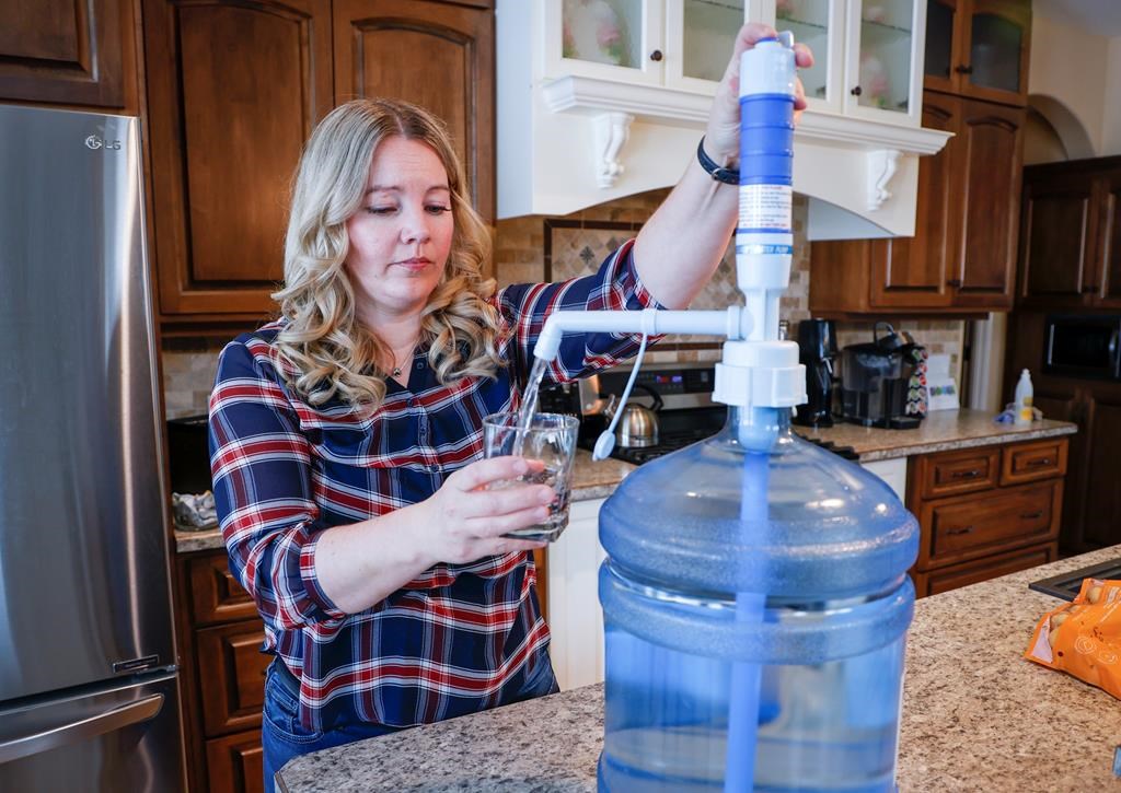 Jody Young and her family are having to use bottled water after their well became so contaminated by lead it's no longer drinkable, near Red Deer, Alta., Wednesday, Jan. 11, 2023.