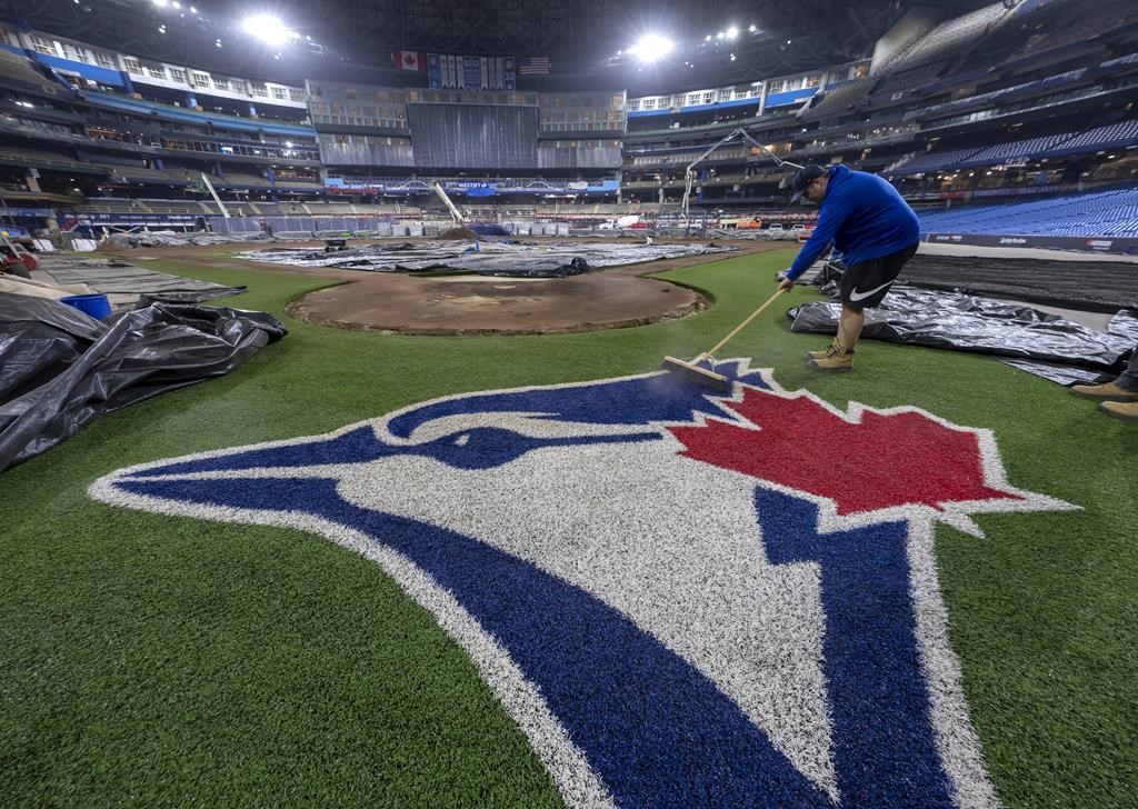 The Toronto Blue Jays offered a glimpse of their ballpark’s renovations today. Toronto Blue Jays grounds crew member Tyler Holmes sweeps the team logo in the middle of the Rogers Centre renovation in Toronto on Tuesday January 17, 2023. THE CANADIAN PRESS/Frank Gunn