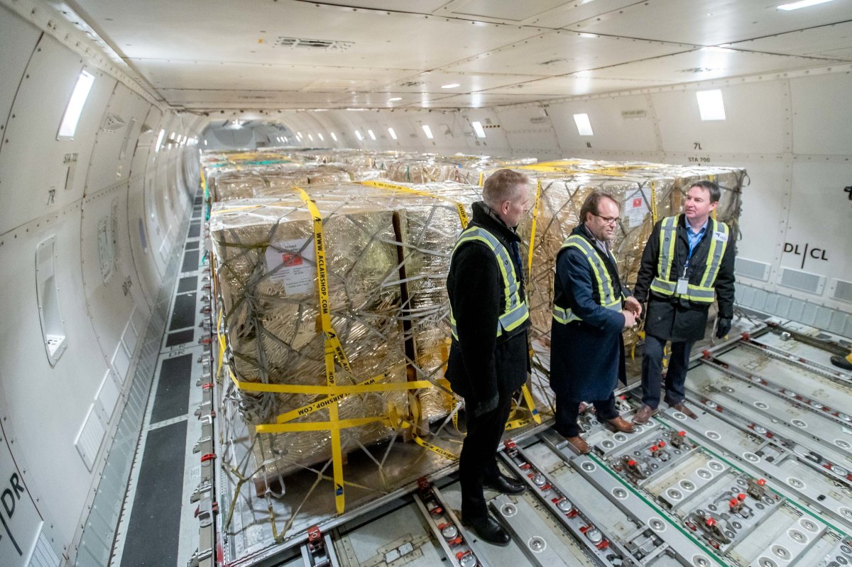 Deputy Premier Nathan Neudorf, Myron Keehn, CEO of Edmonton International Airport and Minister of Health Jason Copping meet the flight carrying the first shipment of children’s pain medication at the Edmonton International Airport on January 18, 2023.