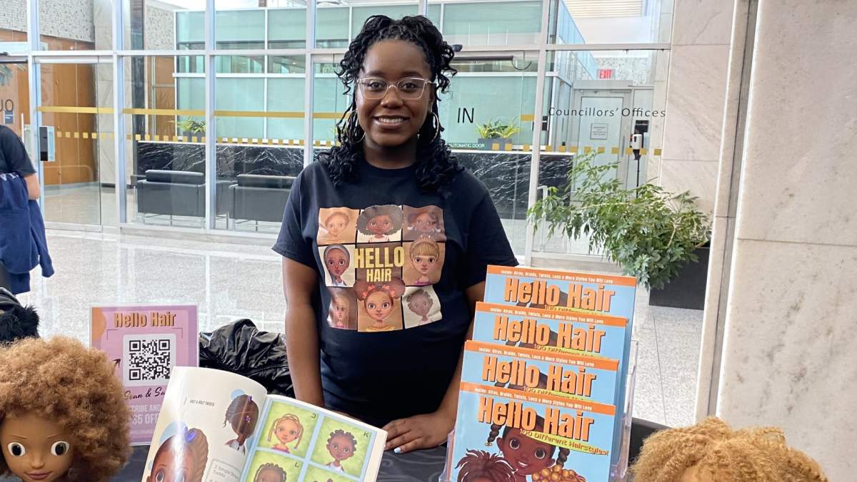 Anita Grant displays her book “Hello Hair” – a children’s book that celebrates 100 natural Black hairstyles.