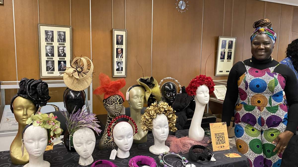 Tolu Oyetunji displays her handmade statement headpieces that she sells through Coral Earth Finery on Instagram.