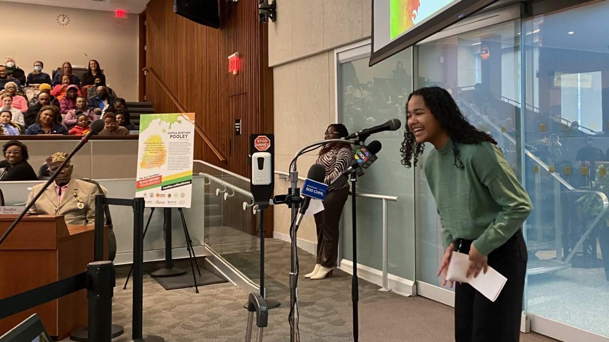 Ainara Alleyne laughs while addressing those gathered for the launch of Hamilton's "Black History Remembered" initiative.