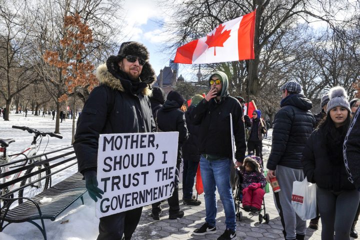 Anti-mandate protesters, also known as Freedom Convoy, rally at Ontario's Queen's Park in Toronto to oppose anti-mandates imposed by the government. A protester carrying a "Mother, Should I trust the government?" signage in Toronto, Ontario, February 12, 2022. 