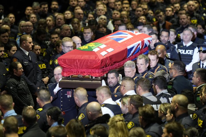 Pallbearers carry the casket of OPP Const. Grzegorz (Greg) Pierzchala during his funeral service in Barrie, Ont., Wednesday, Jan.4, 2023.