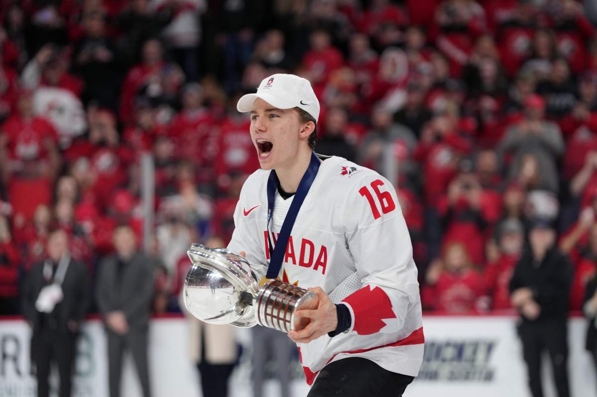 Canada’s Connor Bedard carries the IIHF Championship Cup while celebrating winning over Czechia at the IIHF World Junior Hockey Championship gold medal game in Halifax on Thursday, January 5, 2023. THE CANADIAN PRESS/Darren Calabrese