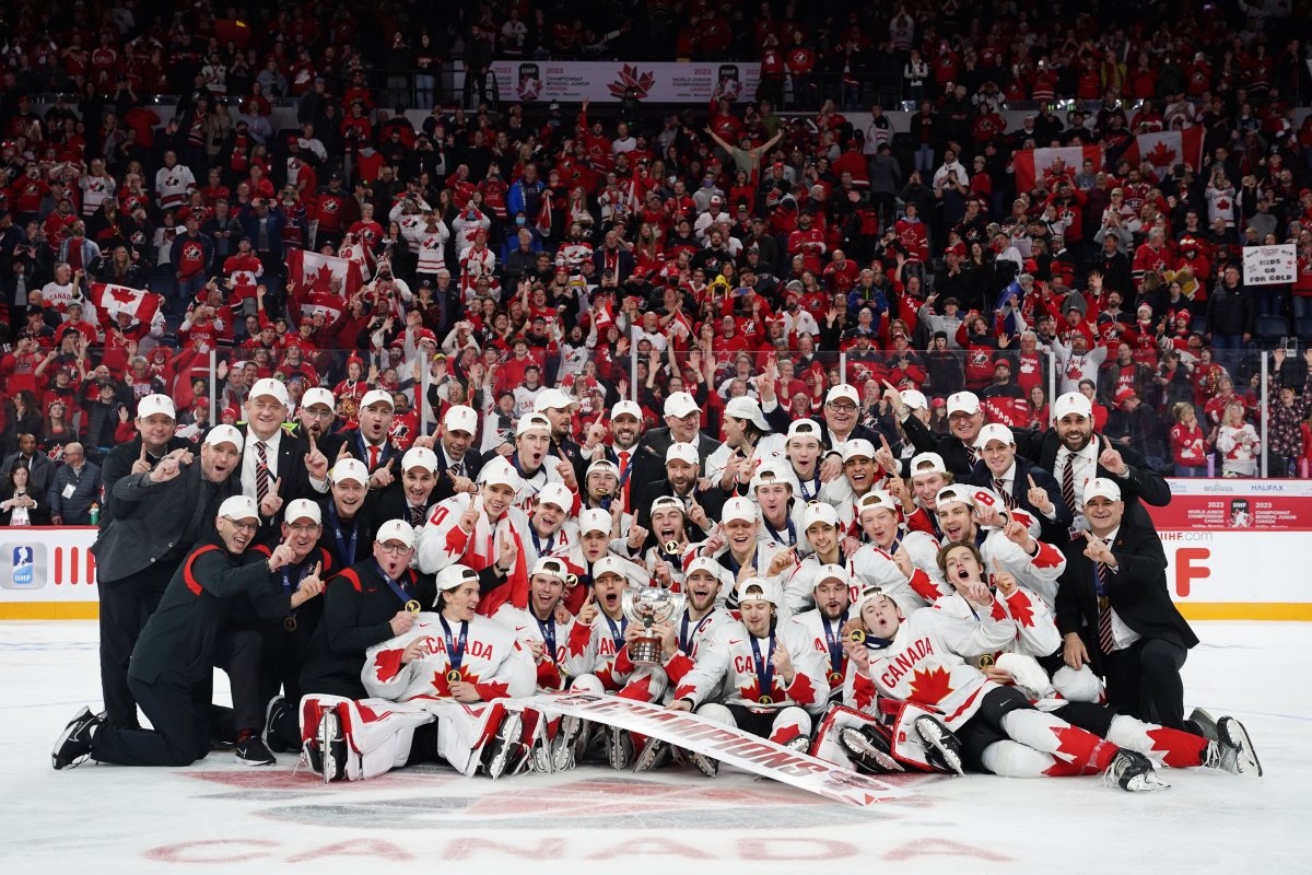 Team Canada poses while celebrating winning over Czechia during overtime of the IIHF World Junior Hockey Championship gold medal game in Halifax on Thursday, January 5, 2023. THE CANADIAN PRESS/Darren Calabrese.