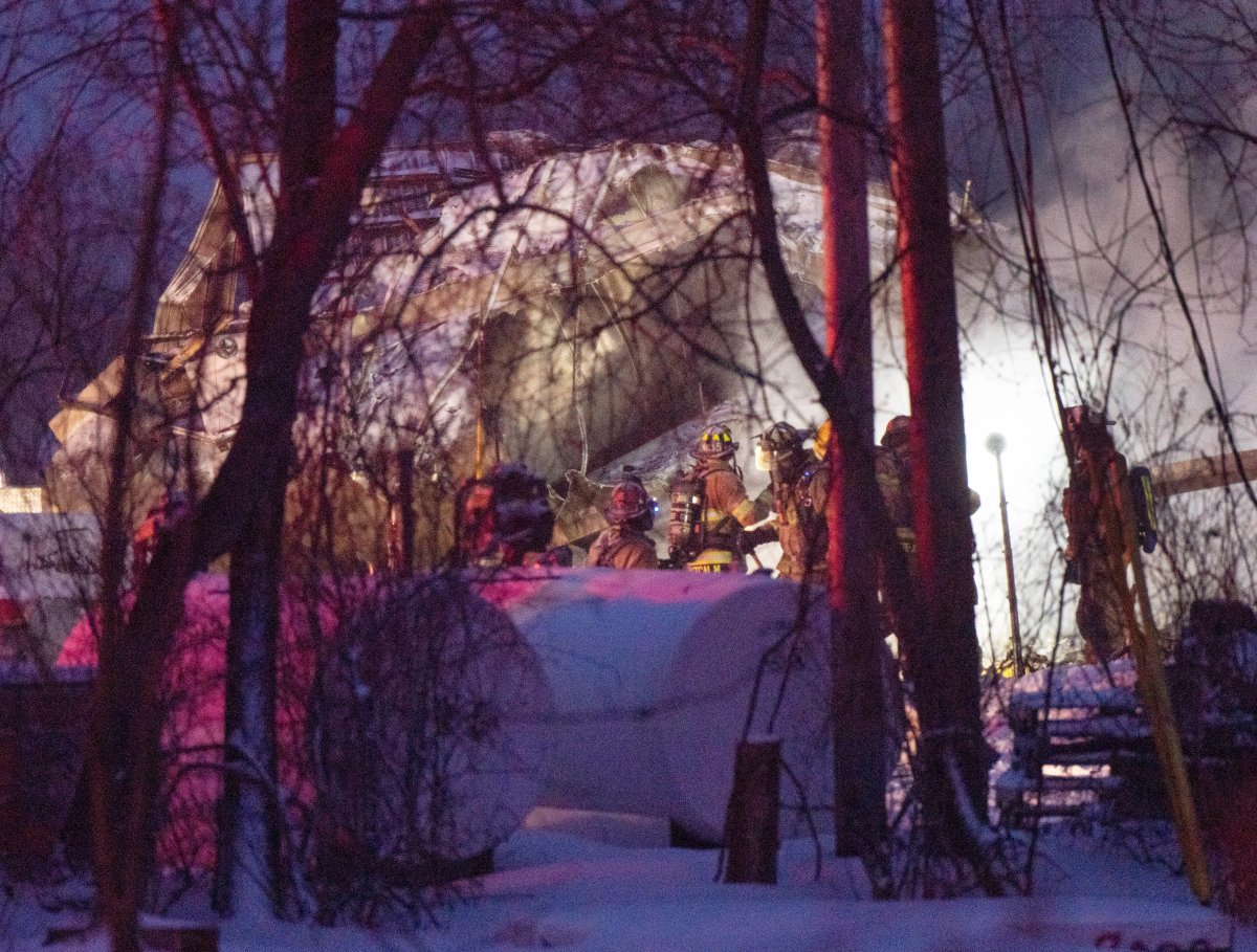 Firefighters work the scene after an explosion at a propane company, Thursday, January 12, 2023  in Saint-Roch-de-L’Achigan, Que. 