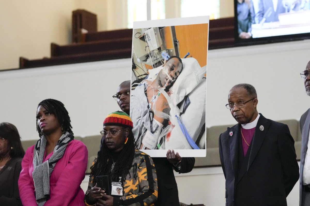 FILE - Family members and supporters hold a photograph of Tyre Nichols at a news conference in Memphis, Tenn., Jan. 23, 2023. The U.S. Attorney’s Office said Wednesday, Jan. 25, 2023 the federal investigation into the death of a Black man who died after a violent arrest by Memphis police “may take some time.” Speaking during a news conference, U.S. Attorney Kevin G. Ritz said his office is working with the Justice Department's Civil Rights Division in Washington as it investigates the case of Tyre Nichols, who died three days after his Jan. 7 arrest. (AP Photo/Gerald Herbert, file).