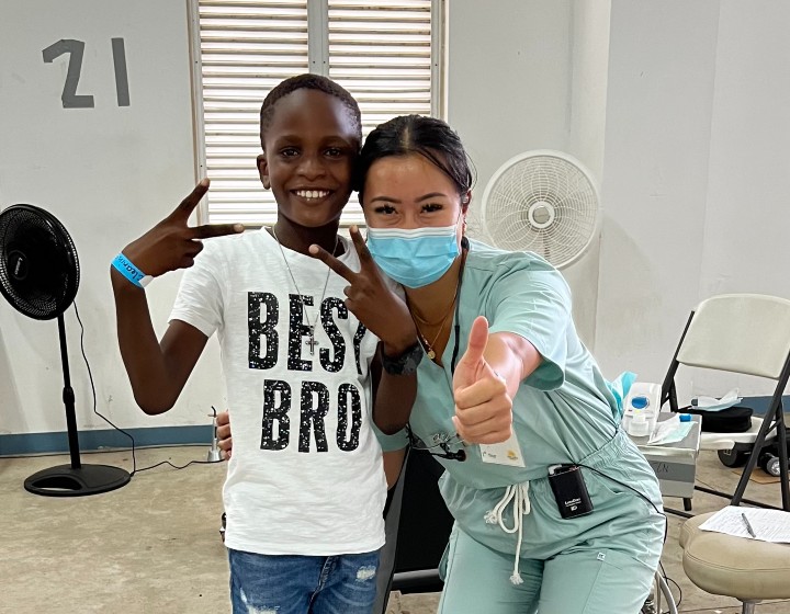 Clara Zhou with her first and favourite patient in Grenada.