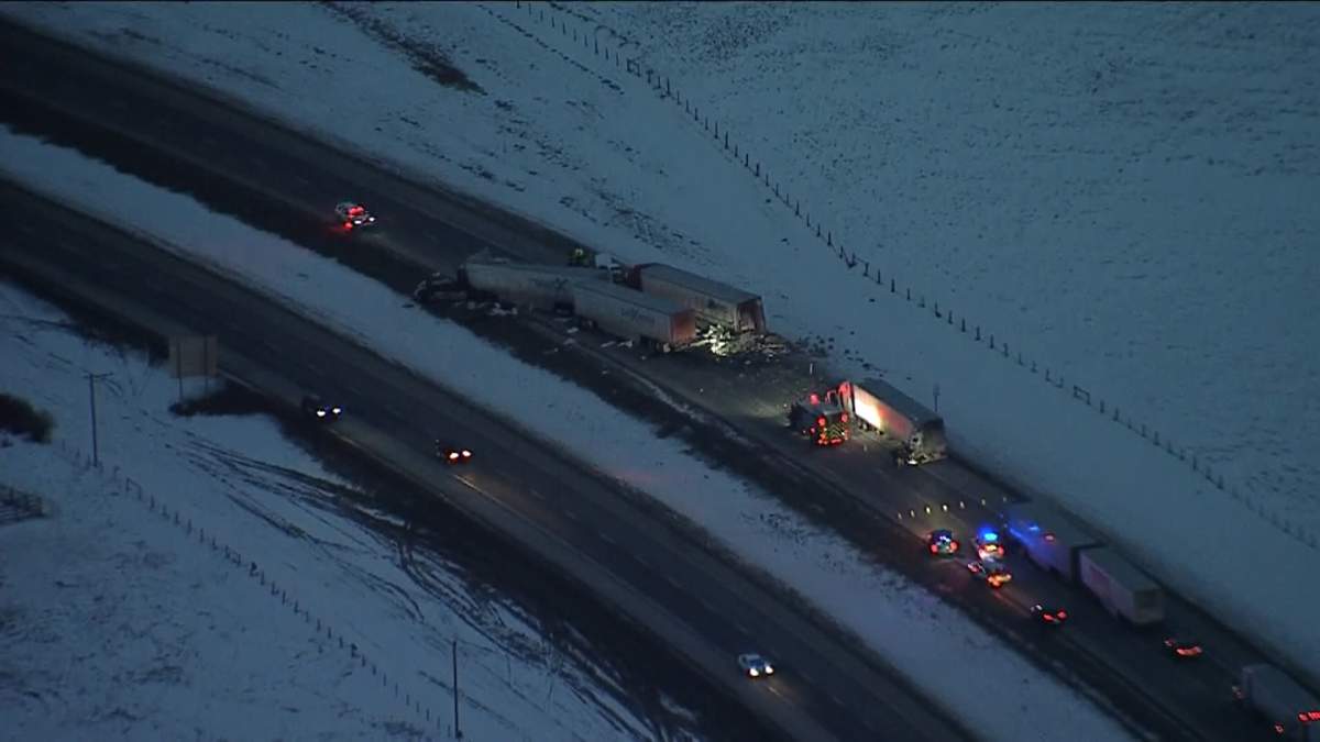 Emergency crews at the scene of a fatal crash involving what appears to be three semi and one car on Jan. 20, 2023.