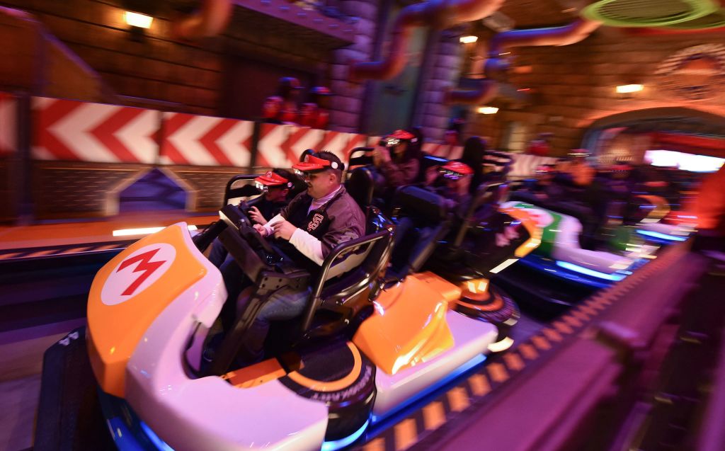 Guests ride Super Mario Kart during a preview of Super Nintendo World at Universal Studios in Los Angeles, California, on January 13, 2023.