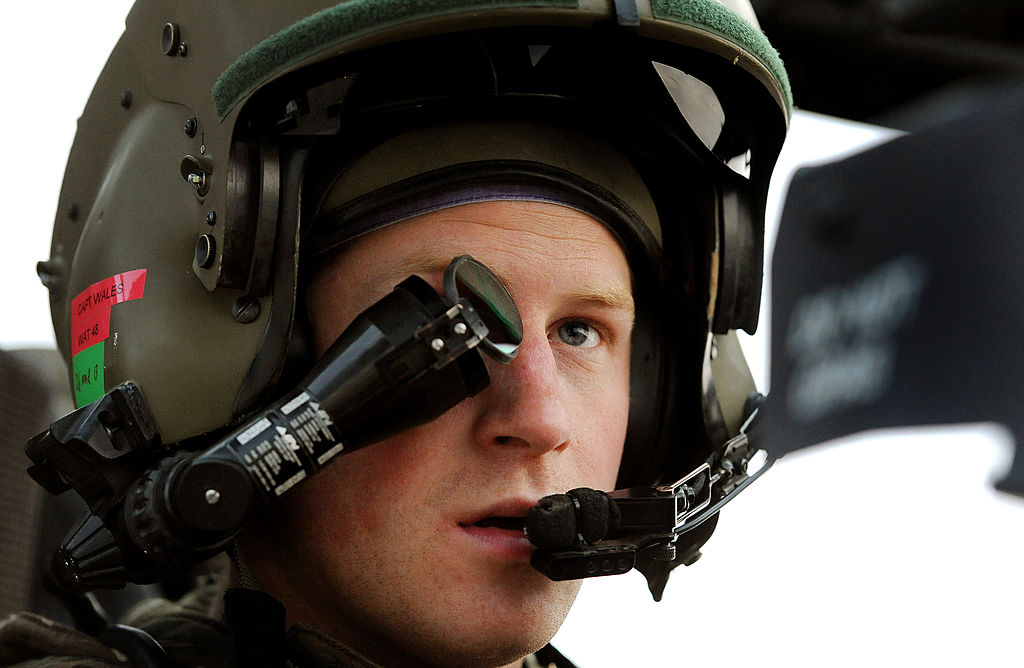 In this image released on January 21, 2013, Prince Harry, wears his monocle gun sight as he sits in the front seat of his cockpit at the British controlled flight-line at Camp Bastion on December 12, 2012 in Afghanistan.