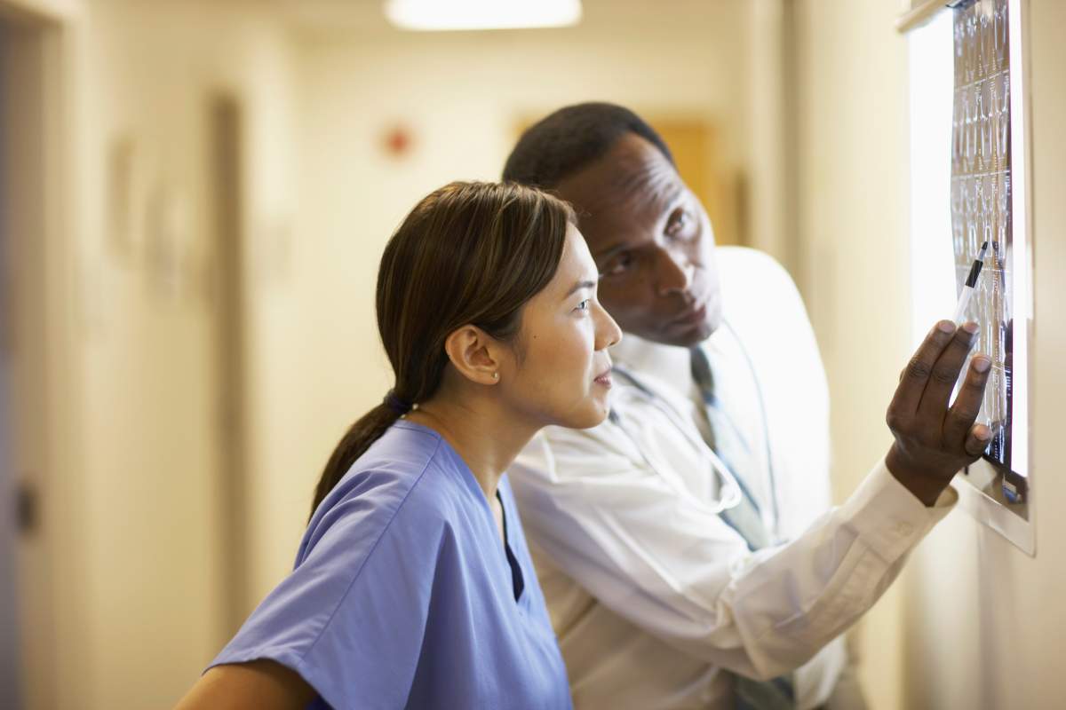 Doctor looking at x-ray with nurse