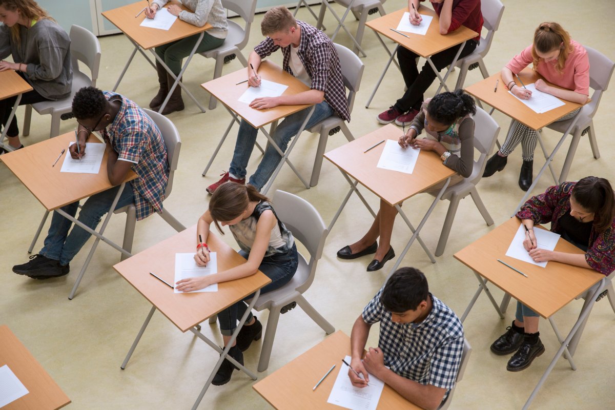 File - Elevated view of students writing an exam.