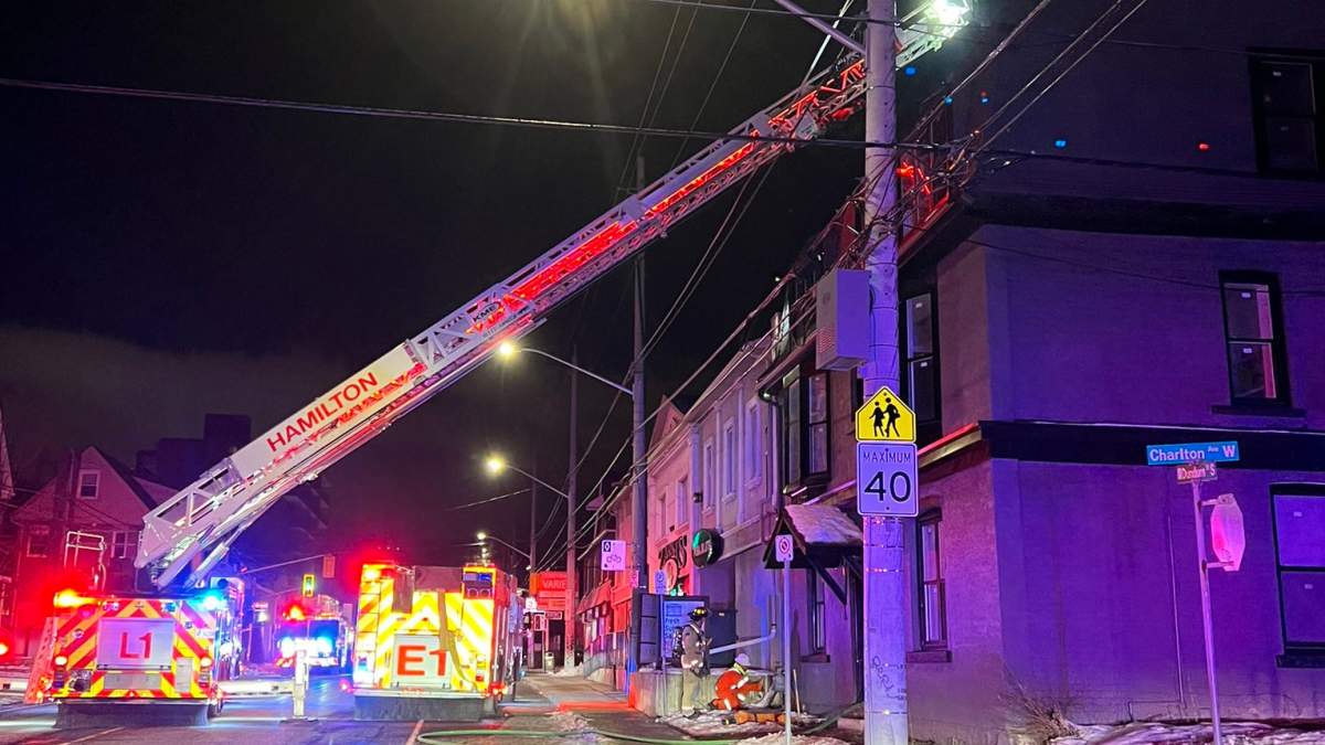 Firefighters battling a blaze at a residential Building at Dundurn Street South and Charlton Avenue in Hamilton Monday Jan 30, 2023.