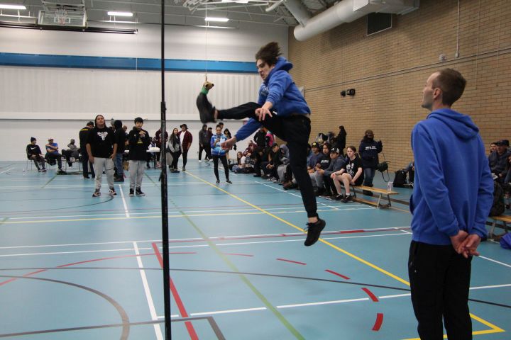 Jordan Wills participates in the one-foot high kick discipline at the Team Alberta North Arctic sports trials in Slave Lake, Alta., Nov. 26, 2022. The Arctic Winter Games are a family affair for siblings Brooklyn and Jordan Wills of Team Alberta North. Mother Ashleigh is a team mission staff member and father Cory previously competed and coached at the Games.