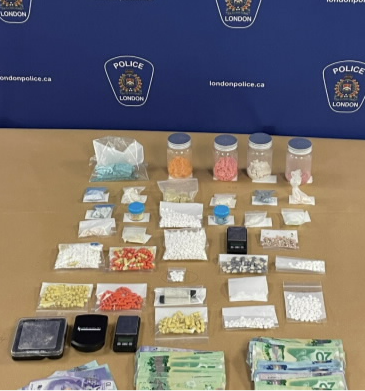 Collection of drugs and money seized by police