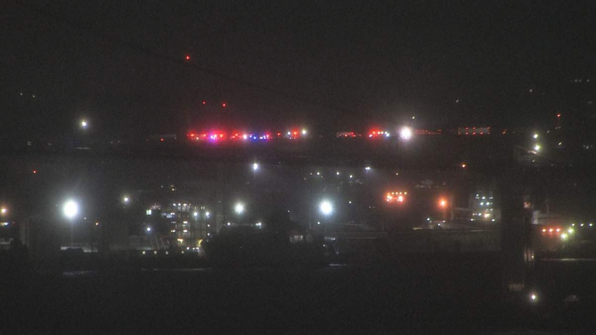 Emergency vehicles are seen on the MacKay Bridge early Tuesday morning.