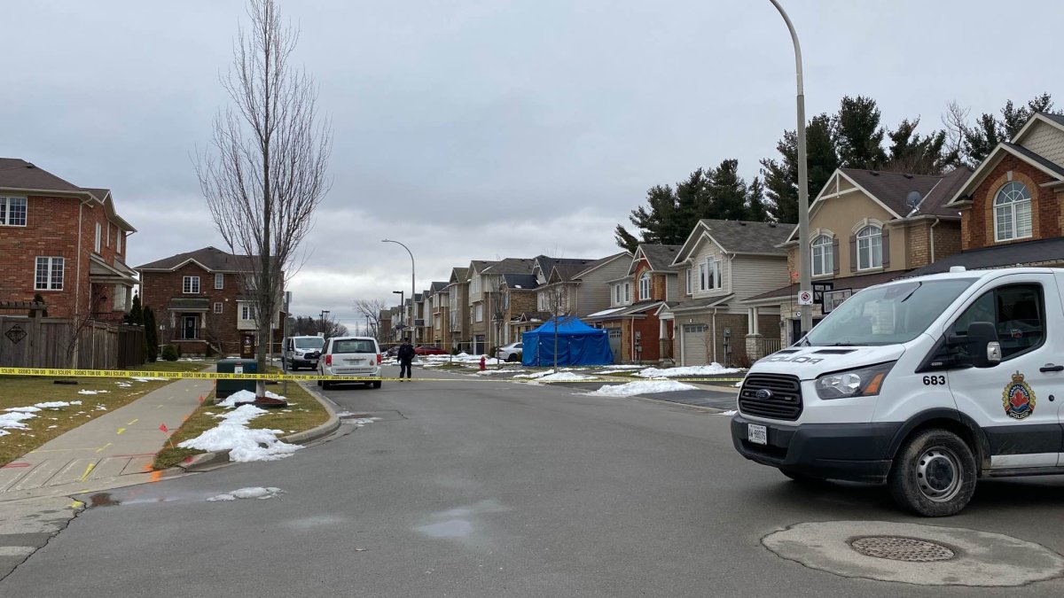 Hamilton police in a neighbourhood on Emick Drive in Ancaster, Ont. following the discovery of a seriously injured woman on a nearby street Jan. 18, 2023.