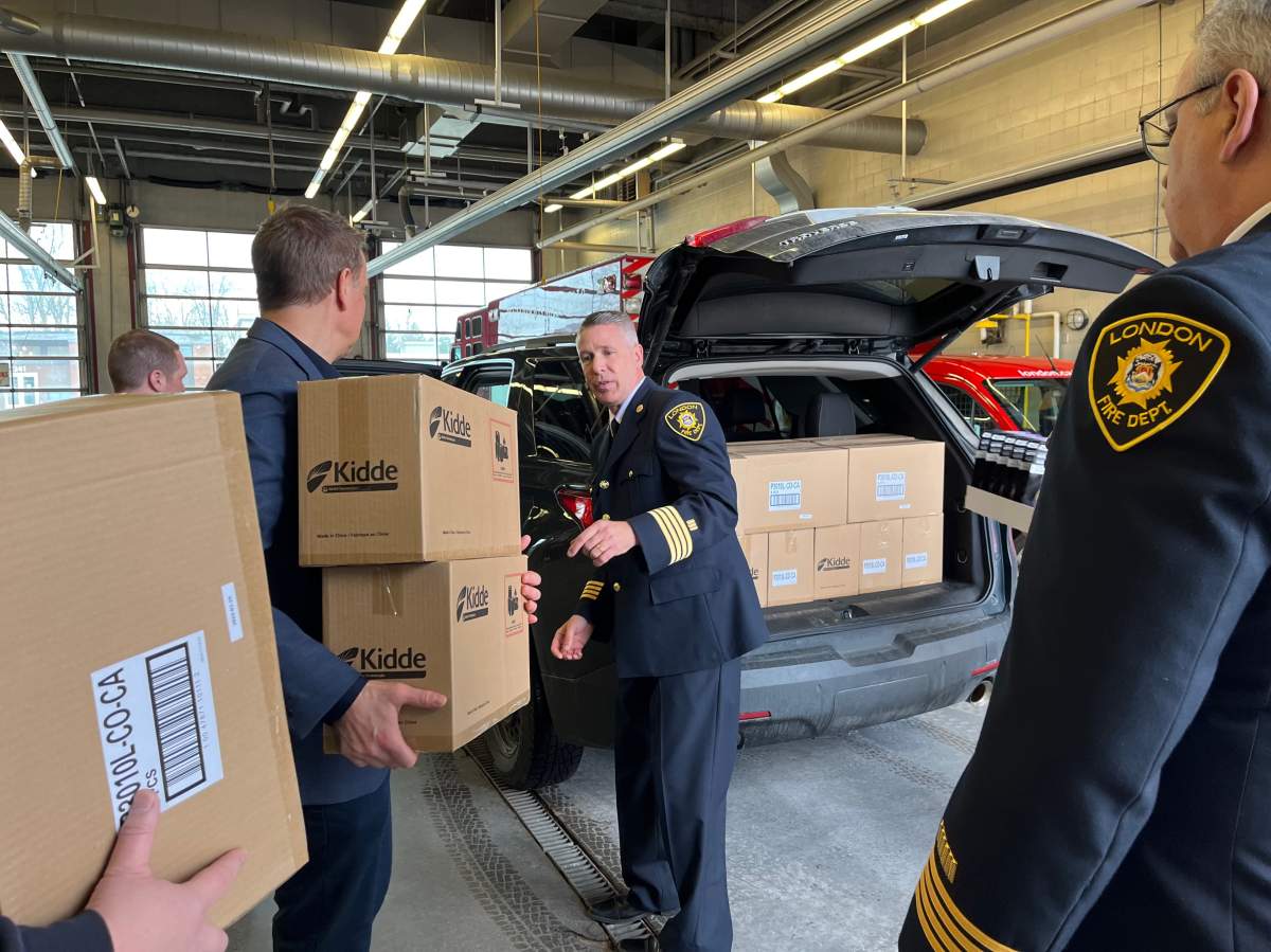 A fresh batch of combination smoke and carbon monoxide are loaded into a vehicle for the Project Home housing stability in London, Ont.