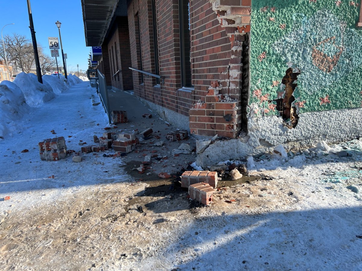 A Winnipeg police car crashed into a building after a collision on Friday, police say.