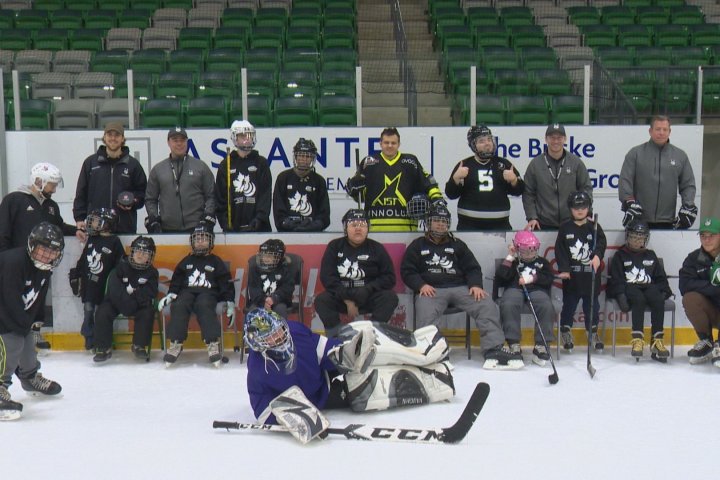 Huskies share love of hockey with blind youth in Saskatoon